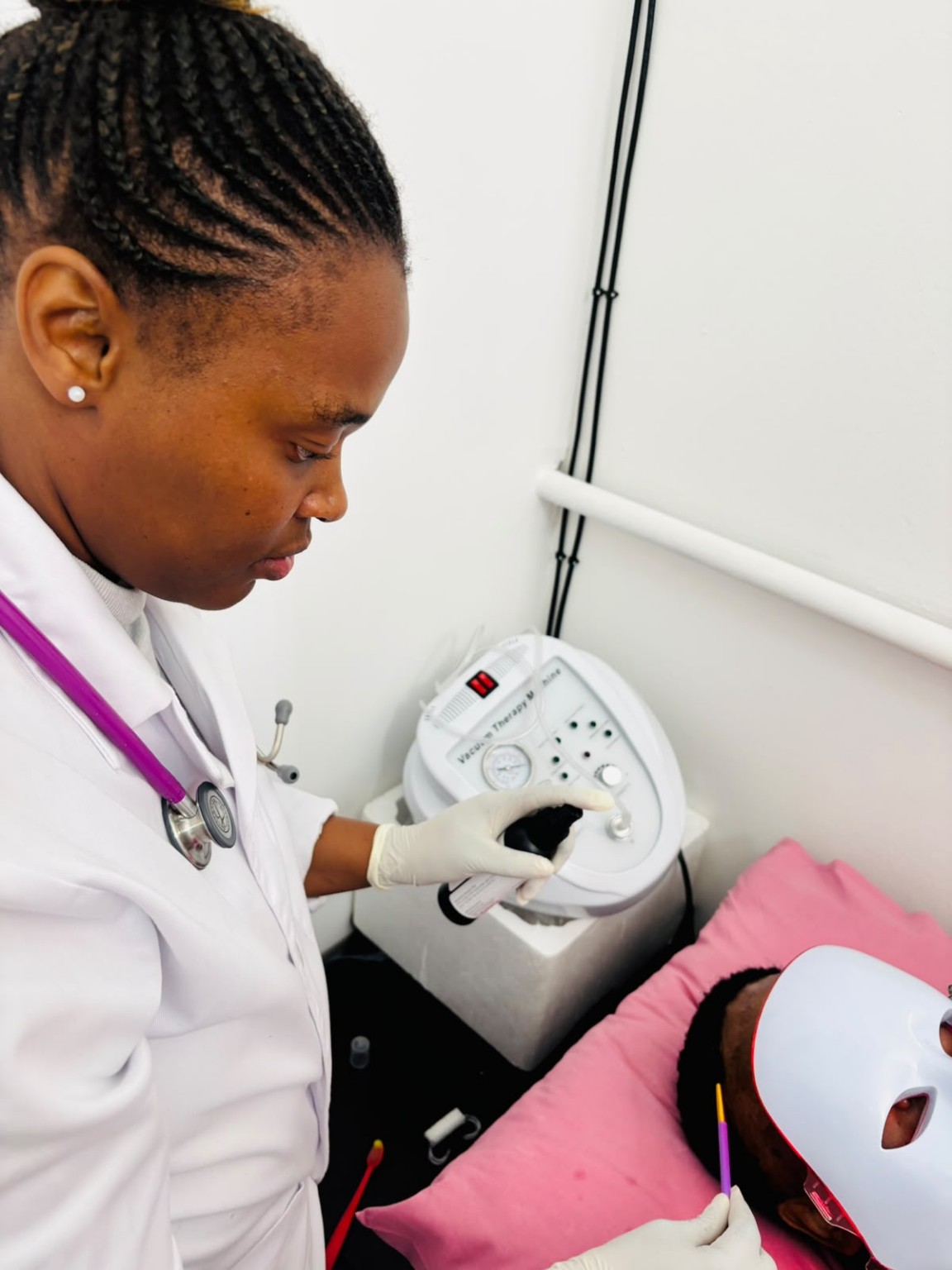 Dr Mahanke in uniform providing hair treatment